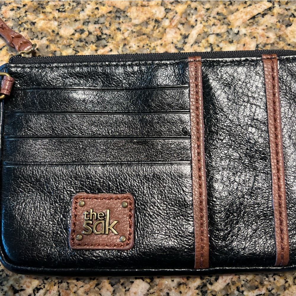 The SAK leather wristlet wit detachable strap.  ECU